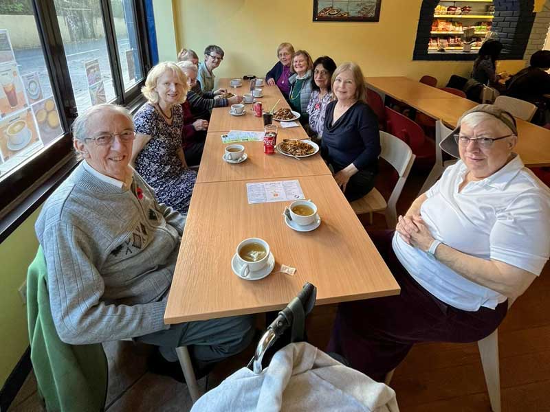 Photo of community members sharing a meal out