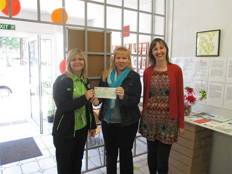 Career Central receiving a cheque from the Asda Community Champion fund for the project, run at the Mascot Hub.